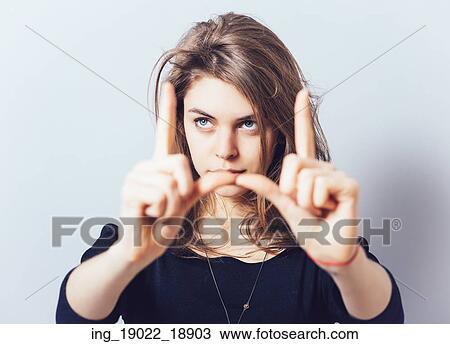 Stock Image - girl doing hand frame. Fotosearch