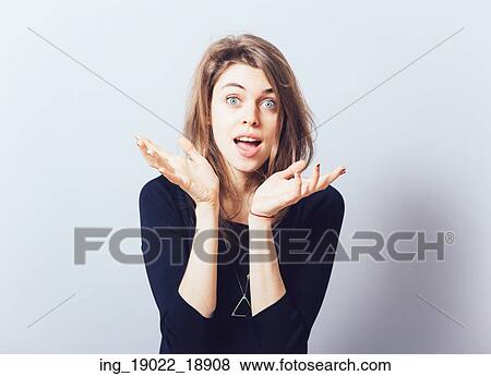 girl holding something in his hand. Isolated on gray background View Large Photo Image Stock Photo - girl holding something in his hand. Isolated on gray background. Fotosearch