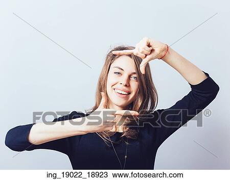 Stock Image - girl makes a frame arms. Fotosearch