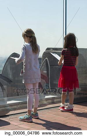 Stock Photograph - Girls at Top of the Rock observation deck, Midtown Manhattan, New York City, New York State, USA. Fotosearch