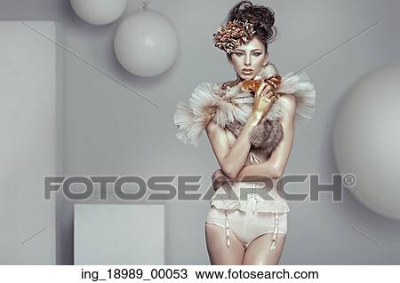 Stock Image - Glamour style photo of alluring brunette lady. Fotosearch