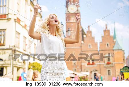 Gorgeous lady making soap bubbles View Large Photo Image Stock Photo - Gorgeous lady making soap bubbles. Fotosearch