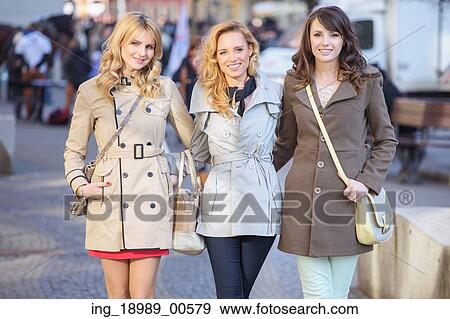 Stock Photo - Group of the young glad girlfriends. Fotosearch