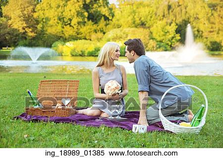 Stock Photography - Handsome guy kissing his wife. Fotosearch