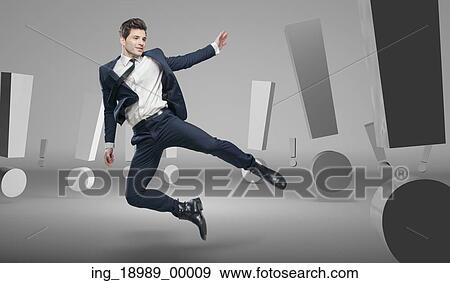 Handsome man in the room of huge exclamation signs View Large Photo Image Stock Photo - Handsome man in the room of huge exclamation signs. Fotosearch