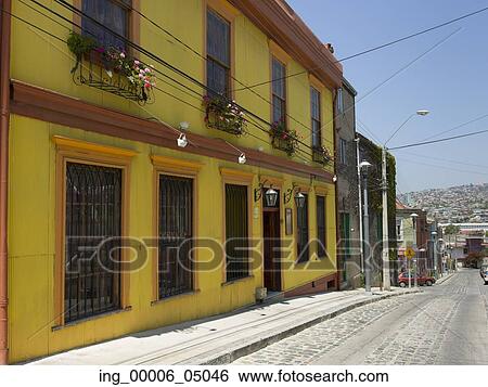 Stock Photograph - Houses along a cobblestone street, Valparaiso, Chile. Fotosearch