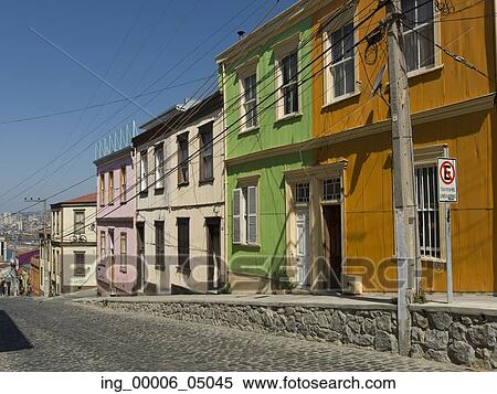 Stock Photography - Houses along a cobblestone street, Valparaiso, Chile. Fotosearch