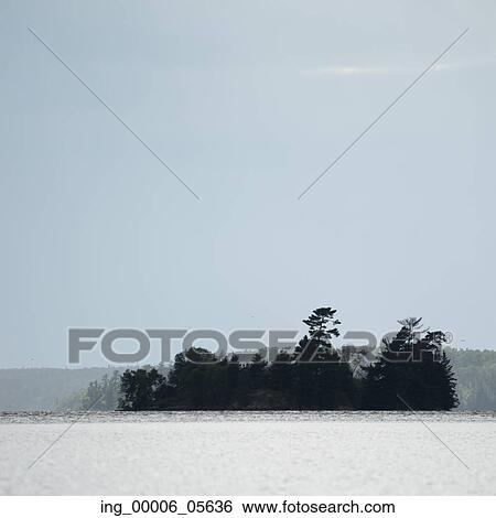 Stock Photograph - Island of trees, Lake Of The Woods, Ontario, Canada. Fotosearch