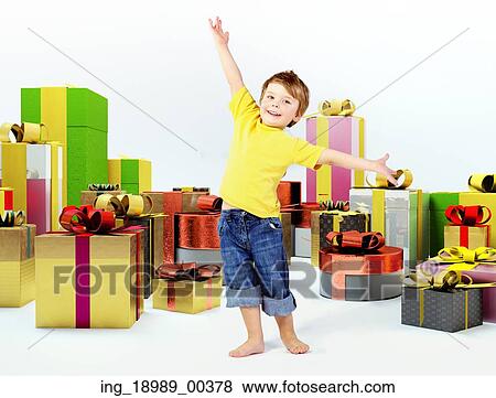 Stock Photo - Joyful kid with lots of presents. Fotosearch