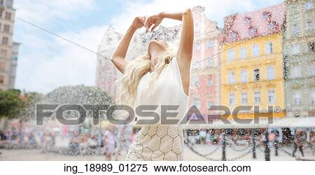 Stock Photography - Joyful woman enjoying the cool water. Fotosearch