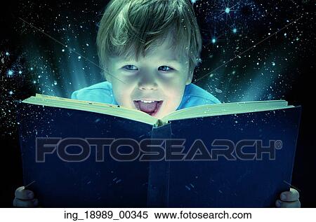 Laughing small boy with the old magic book View Large Photo Image Stock Photography - Laughing small boy with the old magic book. Fotosearch