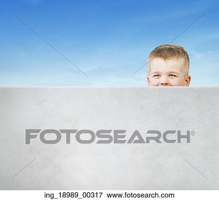 Little boy playing hide and seek View Large Photo Image Stock Photo - Little boy playing hide and seek. Fotosearch