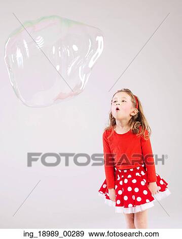 Little cute girl making the soap bubbles View Large Photo Image Stock Photo - Little cute girl making the soap bubbles. Fotosearch
