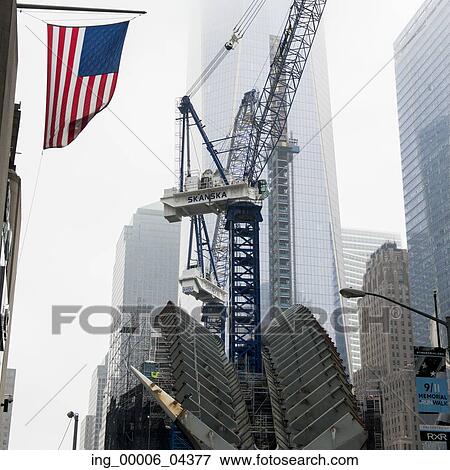 Low angle view of a crane by modern skyscrapers, Manhattan, New York City, New York State, USA View Large Photo Image Stock Photo - Low angle view of a crane by modern skyscrapers, Manhattan, New York City, New York State, USA. Fotosearch