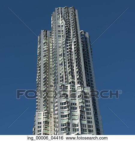 Low angle view of a modern skyscraper, Manhattan, New York City, New York State, USA View Large Photo Image Stock Photograph - Low angle view of a modern skyscraper, Manhattan, New York City, New York State, USA. Fotosearch
