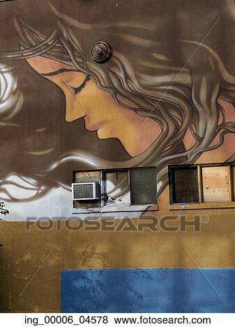 Stock Photo - Low angle view of a mural on the wall of a building at Golden Square Mile, Montreal, Quebec, Canada. Fotosearch