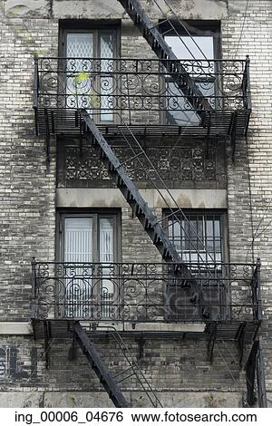 Low angle view of fire escape on a building, SoHo, Manhattan, New York City, New York State, USA View Large Photo Image Stock Photograph - Low angle view of fire escape on a building, SoHo, Manhattan, New York City, New York State, USA. Fotosearch