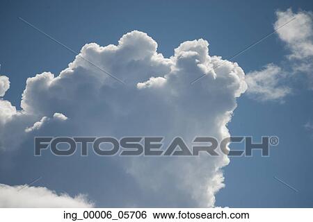 Stock Photograph - Low angle view of fluffy clouds in the sky, Lake Of The Woods, Ontario, Canada. Fotosearch