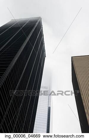 Low angle view of modern skyscrapers, Manhattan, New York City, New York State, USA View Large Photo Image Stock Photo - Low angle view of modern skyscrapers, Manhattan, New York City, New York State, USA. Fotosearch