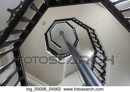 Stock Image - Low angle view of spiral staircase, Manoir-Papineau National Historic Site, Montebello, Quebec, Canada. Fotosearch