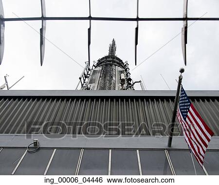 Stock Photograph - Low angle view of the top of the Empire State Building, Manhattan, New York City, New York State, USA. Fotosearch