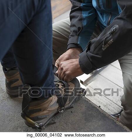 Low section view of men putting on crampon boot, Perito Moreno Glacier, Santa Cruz Province, Patagonia, Argentina View Large Photo Image Stock Image - Low section view of men putting on crampon boot, Perito Moreno Glacier, Santa Cruz Province, Patagonia, Argentina. Fotosearch