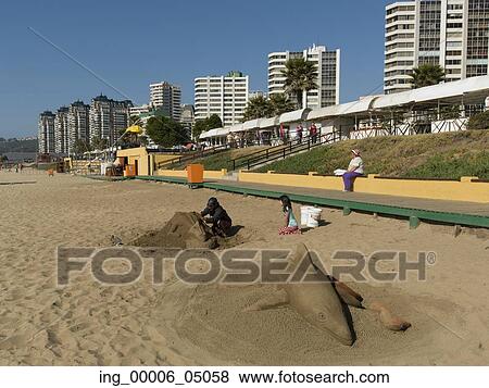 Man making sand sculpture on the beach, Vina Del Mar, Chile View Large Photo Image Stock Photo - Man making sand sculpture on the beach, Vina Del Mar, Chile. Fotosearch