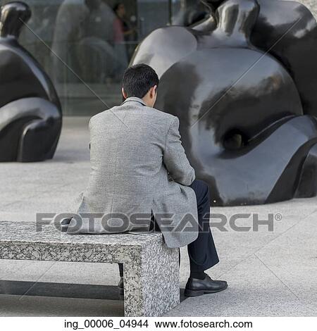 Picture - Man sitting on bench, Santiago, Santiago Metropolitan Region, Chile. Fotosearch