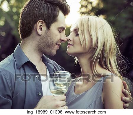 Stock Photograph - Moment before the romantic kiss on the date. Fotosearch