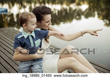 Stock Image - Mother and child staring at something. Fotosearch