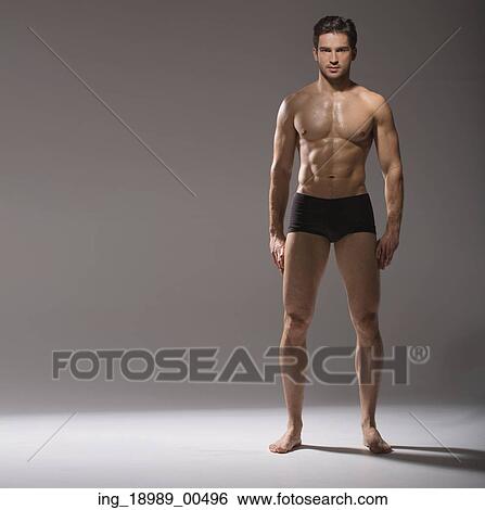 Stock Photograph - Muscular handsome man in calm pose. Fotosearch