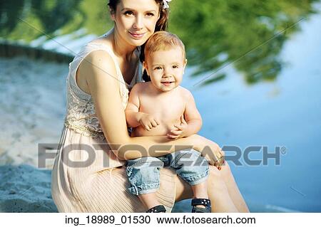 Nice portrait of the mom hugging her baby View Large Photo Image Stock Image - Nice portrait of the mom hugging her baby. Fotosearch