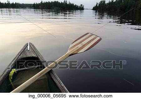 Oar on the side of a canoe on the lake, Lake of the Woods, Ontario, Canada View Large Photo Image Stock Photography - Oar on the side of a canoe on the lake, Lake of the Woods, Ontario, Canada. Fotosearch