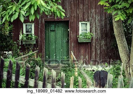 Stock Image - Old house with the deep green door. Fotosearch