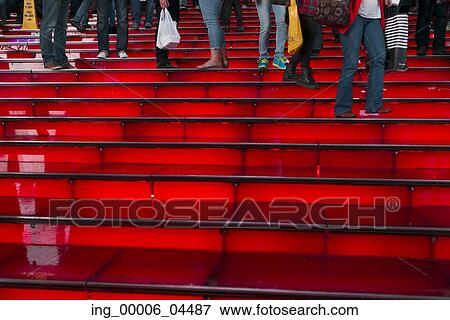 Stock Photo - People on the illuminated steps at Time Square, Manhattan, New York City, New York State, USA. Fotosearch