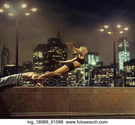 Stock Photograph - People training hard in the evening. Fotosearch