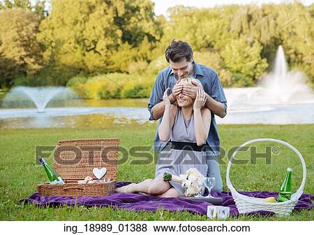 Stock Photo - Photo presenting the romantic date in the park. Fotosearch