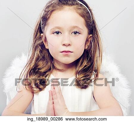 Picture of calm little girl with serious look View Large Photo Image Stock Photograph - Picture of calm little girl with serious look. Fotosearch