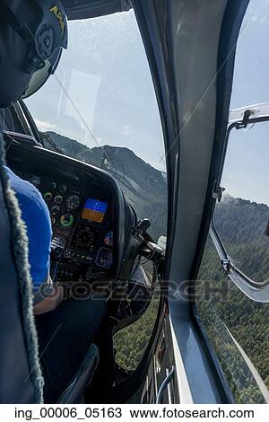 Pilot flying a helicopter, Skeena-Queen Charlotte Regional District, Haida Gwaii, Graham Island, British Columbia, Canada View Large Photo Image Stock Image - Pilot flying a helicopter, Skeena-Queen Charlotte Regional District, Haida Gwaii, Graham Island, British Columbia, Canada. Fotosearch