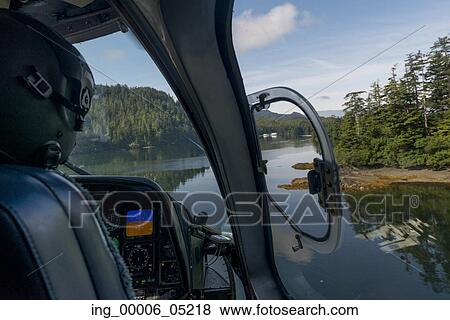 Pilot flying Sikorsky Helicopter, Skeena-Queen Charlotte Regional District, Haida Gwaii, Graham Island, British Columbia, Canada View Large Photo Image Stock Photo - Pilot flying Sikorsky Helicopter, Skeena-Queen Charlotte Regional District, Haida Gwaii, Graham Island, British Columbia, Canada. Fotosearch