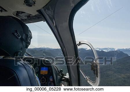 Pilot flying Sikorsky helicopter, Skeena-Queen Charlotte Regional District, Haida Gwaii, Graham Island, British Columbia, Canada View Large Photo Image Stock Photo - Pilot flying Sikorsky helicopter, Skeena-Queen Charlotte Regional District, Haida Gwaii, Graham Island, British Columbia, Canada. Fotosearch
