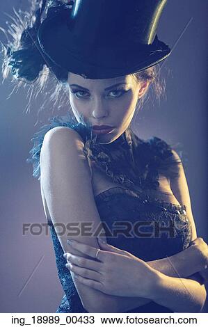 Portrait of a attractive young female model with the black top hat View Large Photo Image Stock Image - Portrait of a attractive young female model with the black top hat. Fotosearch