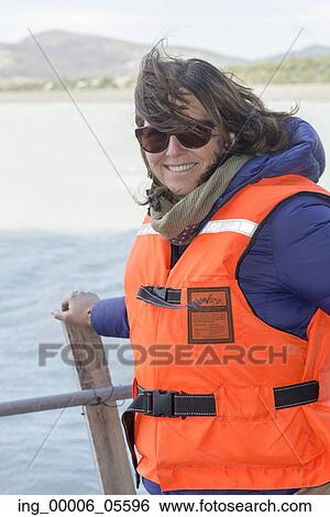 Portrait of a woman smiling, Grey Lake, Torres del Paine National Park, Patagonia, Chile View Large Photo Image Stock Photograph - Portrait of a woman smiling, Grey Lake, Torres del Paine National Park, Patagonia, Chile. Fotosearch