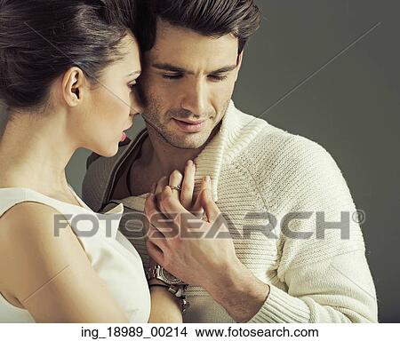 Portrait of attractive young couple in love pose View Large Photo Image Picture - Portrait of attractive young couple in love pose. Fotosearch