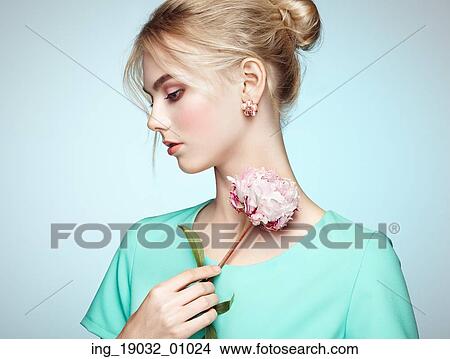 Picture - Portrait of beautiful sensual woman with elegant hairstyle. Perfect makeup. Blonde girl. Fashion photo. Flowers. Fotosearch