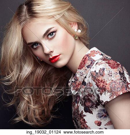 Picture - Portrait of beautiful sensual woman with elegant hairstyle. Perfect makeup. Blonde girl. Fashion photo. Jewelry and dress. Fotosearch