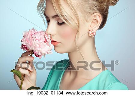 Portrait of beautiful sensual woman with elegant hairstyle. Perfect makeup. Blonde girl. Fashion photo. Flowers View Large Photo Image Picture - Portrait of beautiful sensual woman with elegant hairstyle. Perfect makeup. Blonde girl. Fashion photo. Flowers. Fotosearch