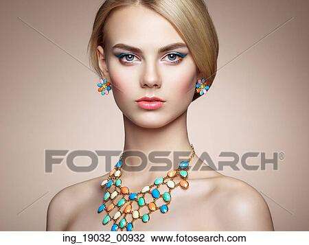 Portrait of beautiful sensual woman with elegant hairstyle. Perfect makeup. Blonde girl. Fashion photo. Jewelry View Large Photo Image Stock Image - Portrait of beautiful sensual woman with elegant hairstyle. Perfect makeup. Blonde girl. Fashion photo. Jewelry. Fotosearch