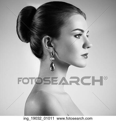 Stock Image - Portrait of beautiful sensual woman with elegant hairstyle. Perfect makeup. Brunette girl. Fashion photo. Fotosearch