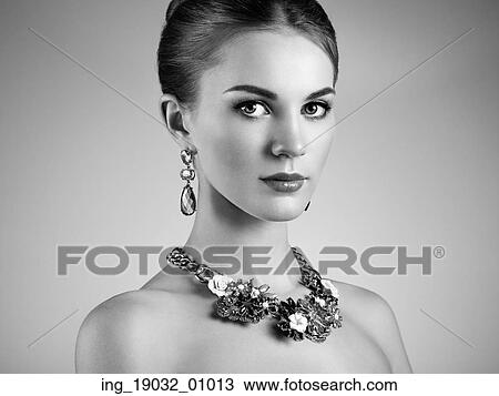 Stock Image - Portrait of beautiful sensual woman with elegant hairstyle. Perfect makeup. Brunette girl. Fashion photo. Fotosearch